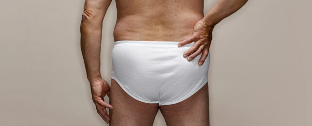 man in white underwear from behind