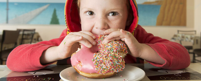 Boy eating a doughnut