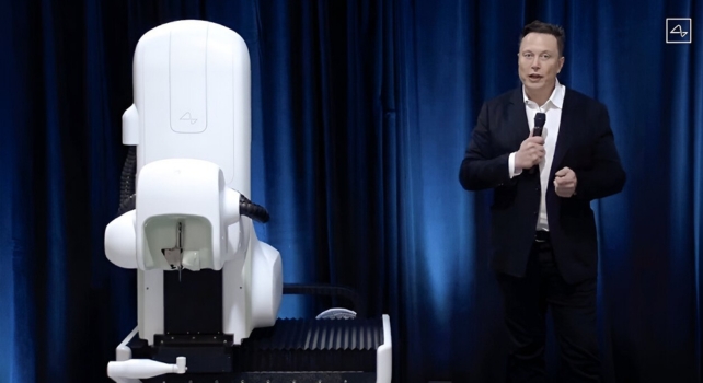 A white robot and Elon Musk on a dark blue background