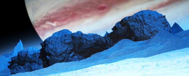 Europa's icy surface with Jupiter looming in background