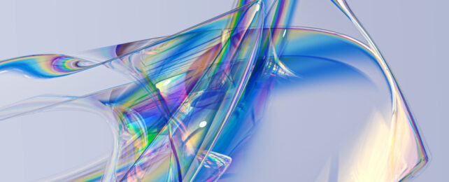 Flexible, translucent material refracting light into a visible spectrum of rainbow colors.