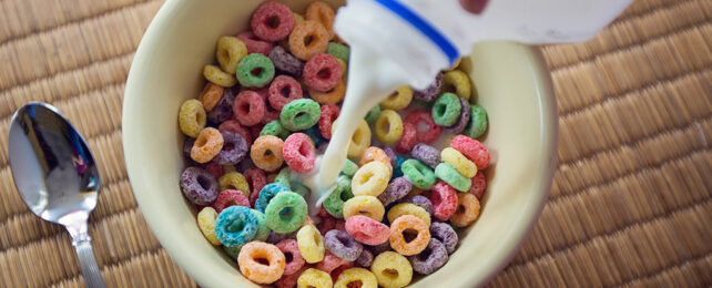 milk poured on colorful cereal