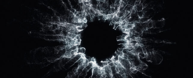 Abstract image of a particle, in grey on black background.