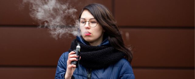 Teenage girl vaping