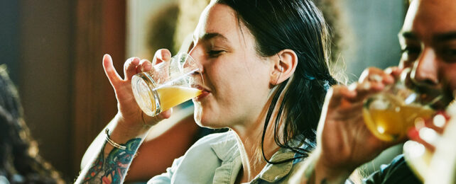 woman at a bar drinking