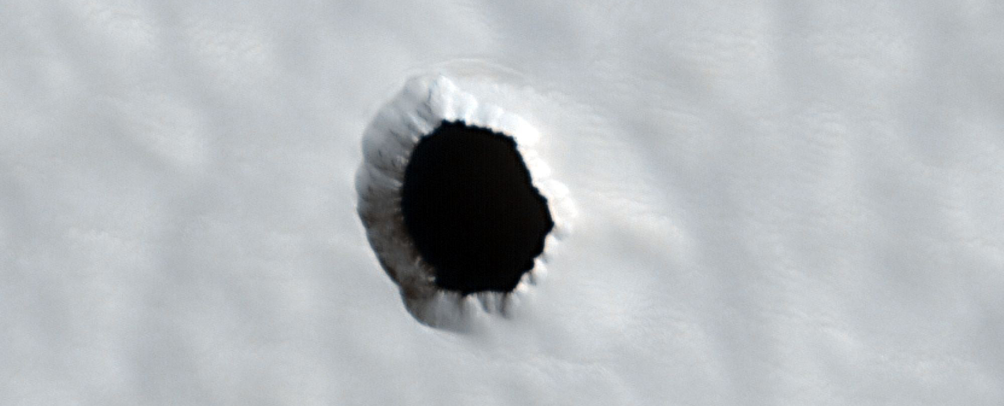 There's a Hole on The Surface of Mars And Scientists Have No Idea What's Inside It