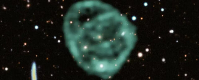Blurry green bubble cloud in space with field of stars