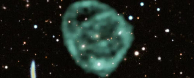 Blurry green bubble cloud in space with field of stars