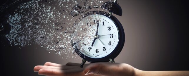 Hand Holds DIssolving Clock