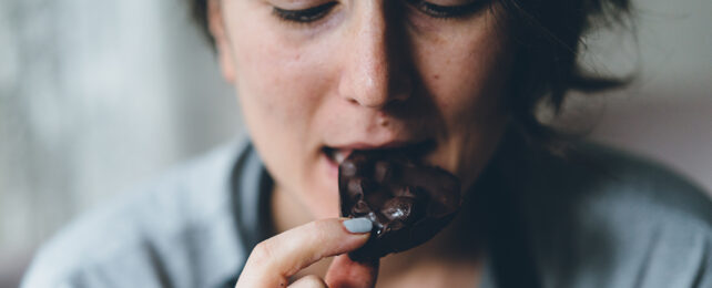 woman eating chocolate