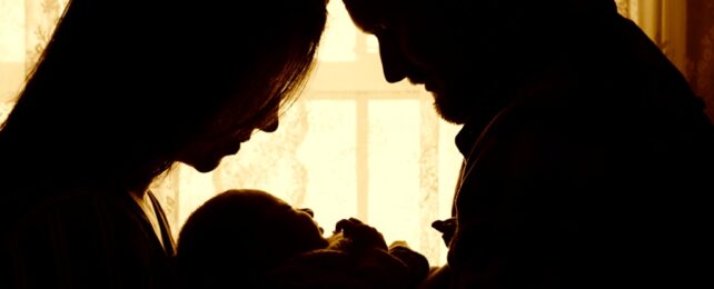 Mother And Father With Baby