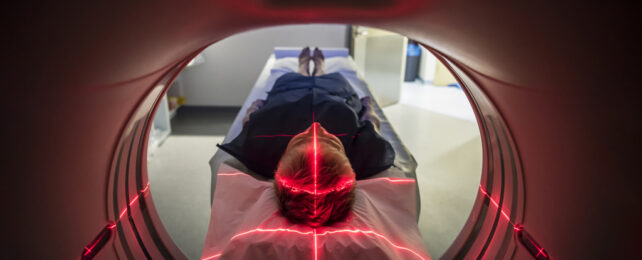 View of man lying down for MRI from inside the machine