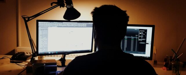 Man On Computer At Night