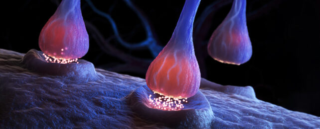 3D illustration of a gold neurotransmitter crossing the gap between neurons