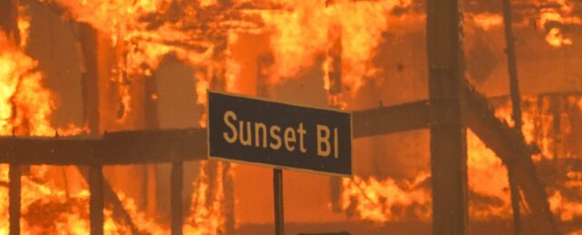 A street sign engulfed by fire