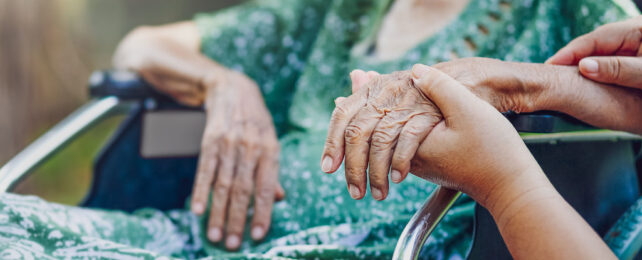 close-up of elderly woman's hands with wrinkled skin