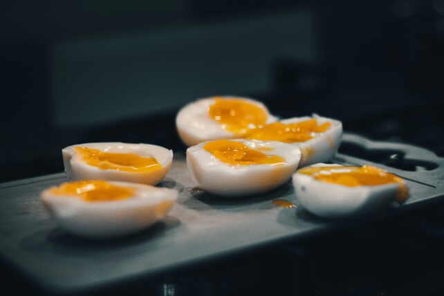 Sliced cooked eggs with gooey centers
