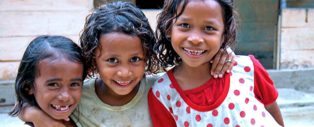group of three smiling girls in Indonesia