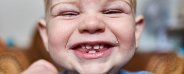Cute little baby boy laughing