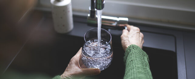 Pouring water from a faucet
