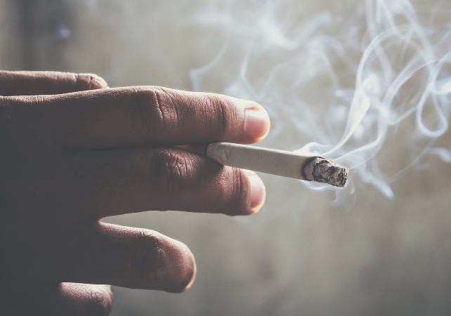 hand holding a cigarette