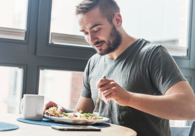 man eating salad