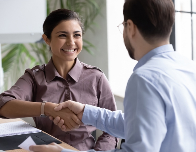 person meeting and shaking hands