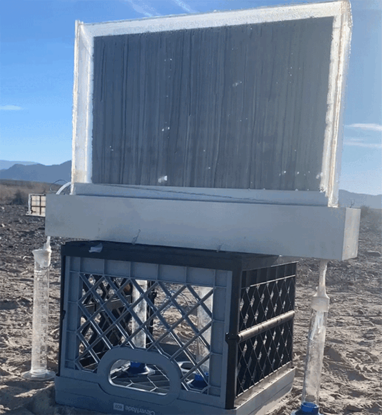 Black, window sized panel, propped up in the desert