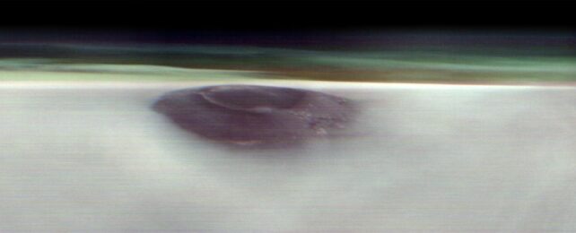 NASA Satellite Glimpses Giant Volcano Peeking Above The Clouds of Mars