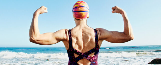 flexing older woman at the beach