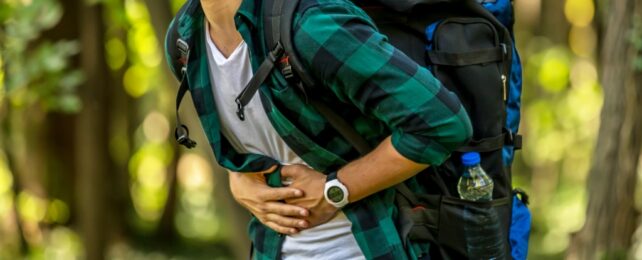 man holding belly