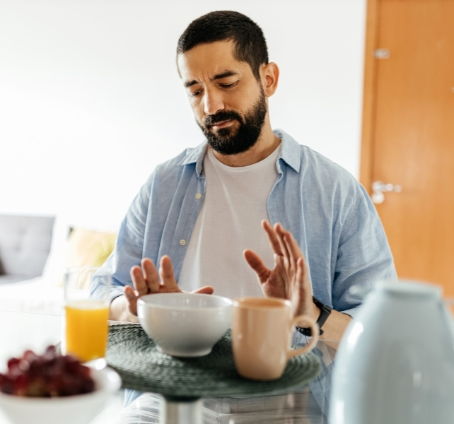 man rejecting food
