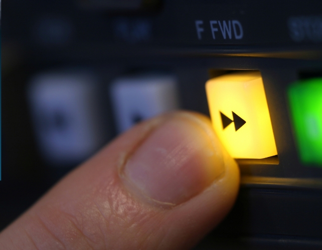 Finger pressing fast forward button