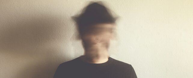 man with blurred face