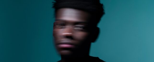 man's face blurred