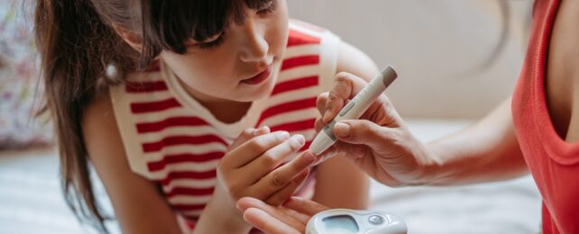 girl getting glucose tested