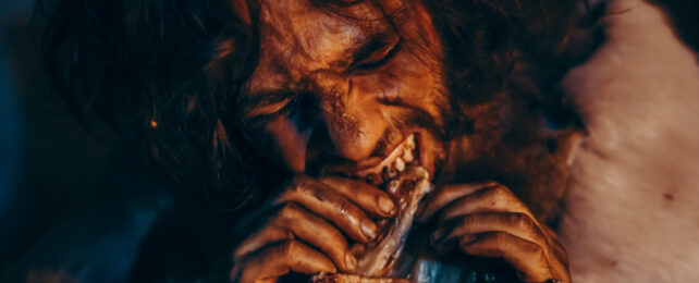 man eating meat