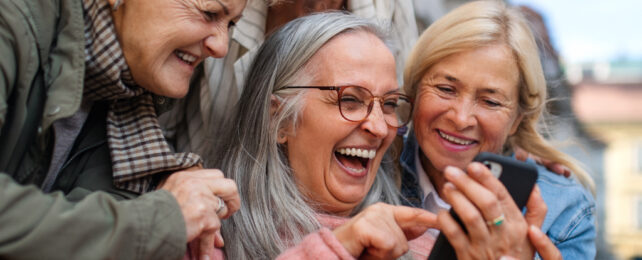 older women looking at a phone
