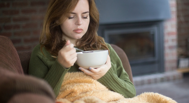 woman eating soup