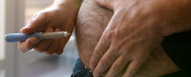 man injecting with weight loss drug