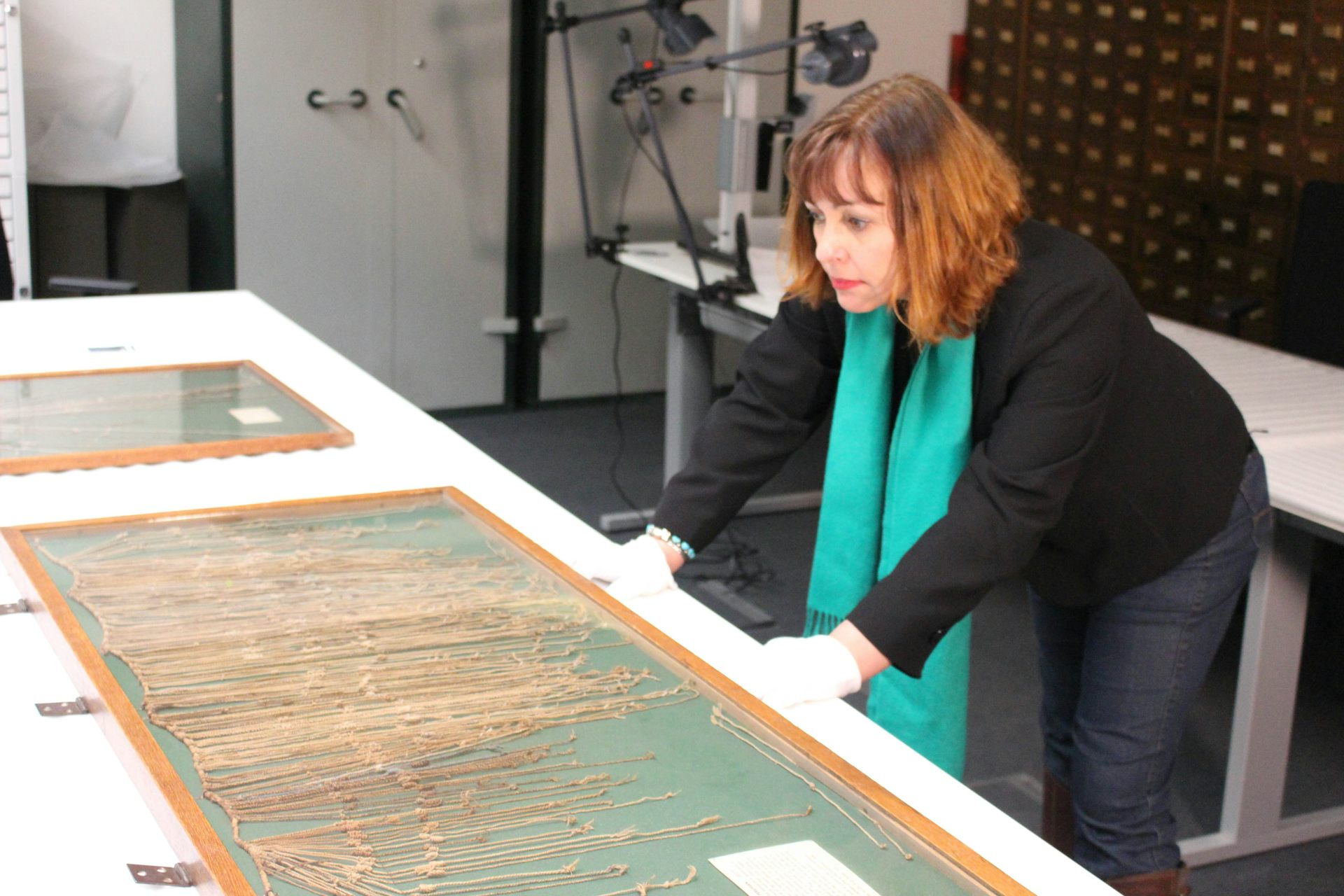 Women looking over framed knotted stings