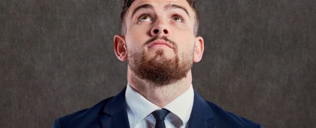 man in a suit looking up