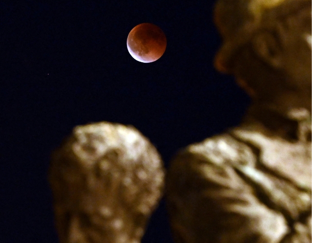 Blood Moon above the monument of the Gemidzhii in Skopje