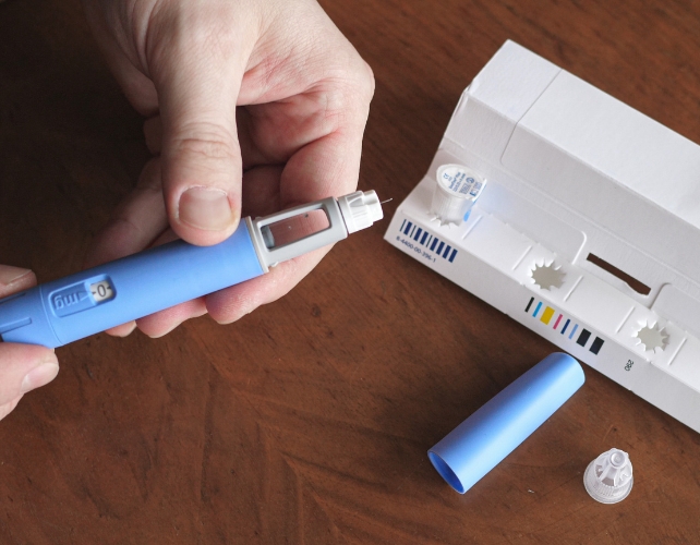 Person's Hands Preparing Semaglutide Injection
