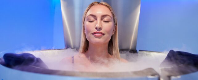 Young Woman in a Whole Body Cryotherapy Cabin