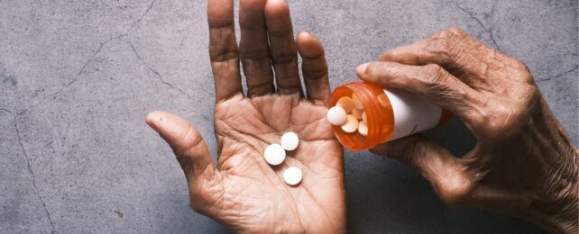 pills in an old man's hand