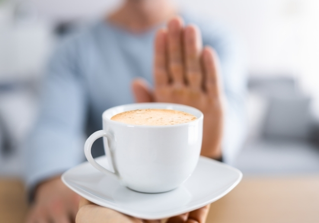 man rejecting coffee