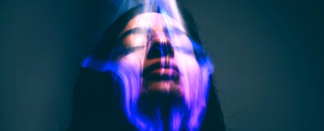 face in glowing light