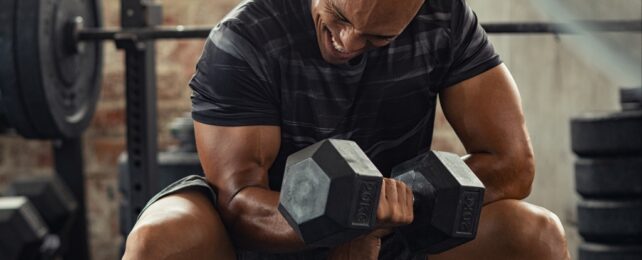 man lifting weights