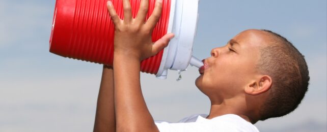 boy drinking from a bottle